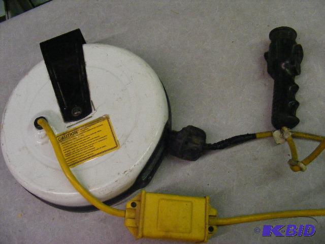lot 80 image: Retractable Extension Cord, cord has tape aro...