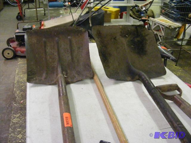 lot 94 image: Two shovels, pitch fork and metal leaf rake...