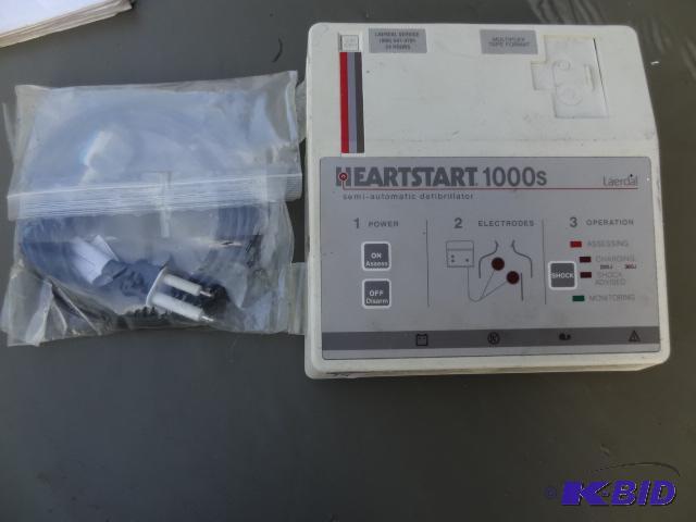 lot 14 image: Heart start 1000S defibrilator...