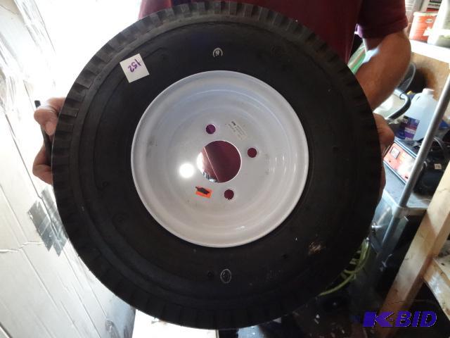 lot 152 image: 2 trailer tires. 4 hole rim. 5.70-8. Sides ar...