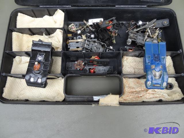 lot 56 image: Misc AFX  HO slot car parts in case...
