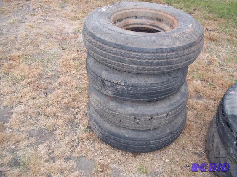 lot 15 image: Trailer house tires with 3 rims...