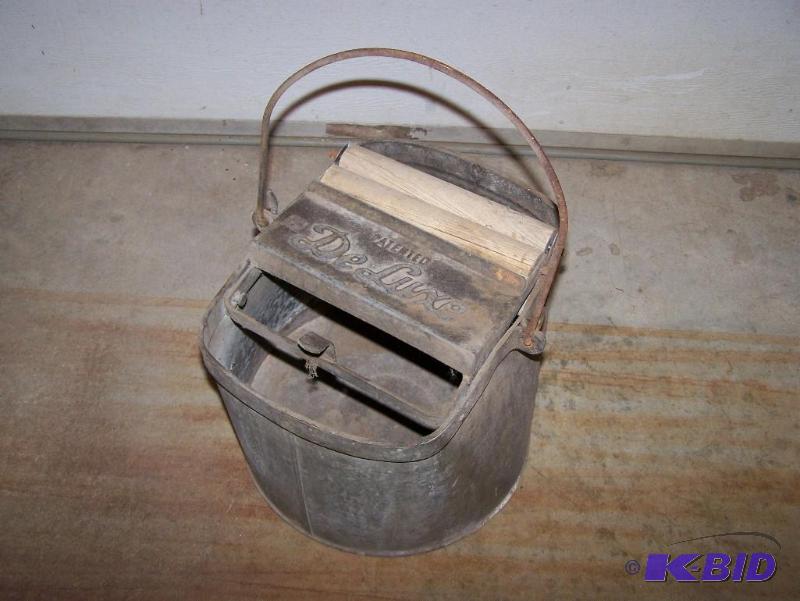 lot 14 image: DeLuxe brand antique mop bucket