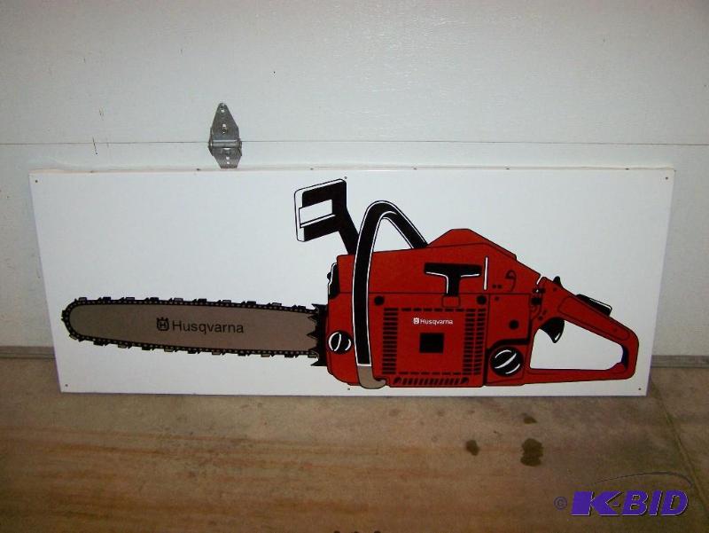 lot 8 image: Vintage Husqvarna chain saw metal sign