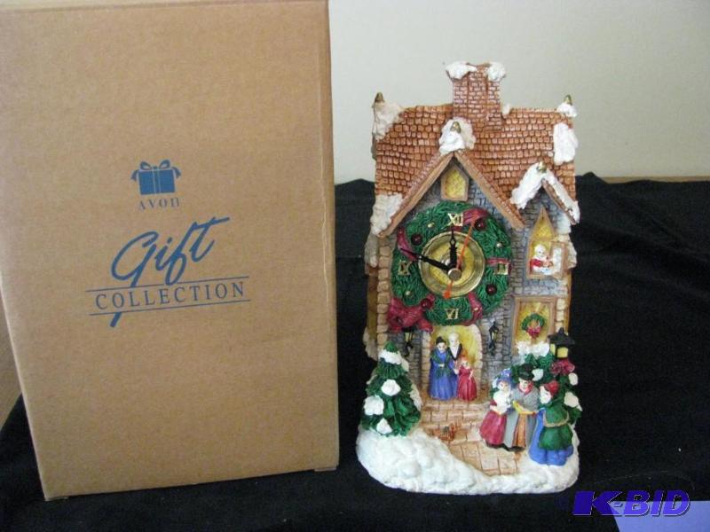 lot 105 image: Avon gift collection, Holiday Melody clock...