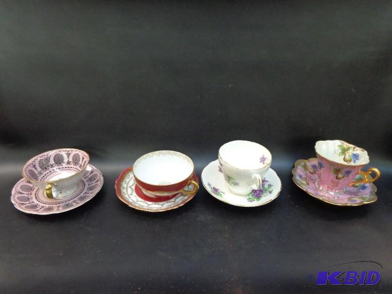 Decorative Plate 4 assorted tea cups with tra...