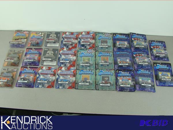 lot 39 image: Lot of 26 New in Package 164 Scale Muscle Machines Die Cast Cars