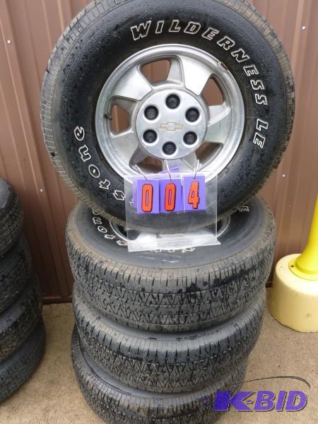 Set of gm 6 hole aluminum rims and tires. fir...