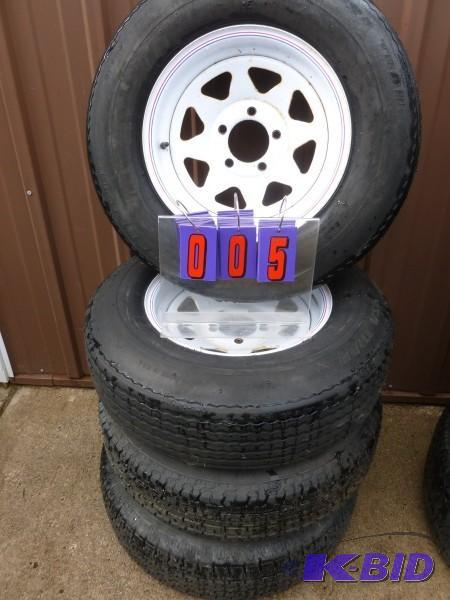 Set of 4 rims &amp tires off of a trailer ap...