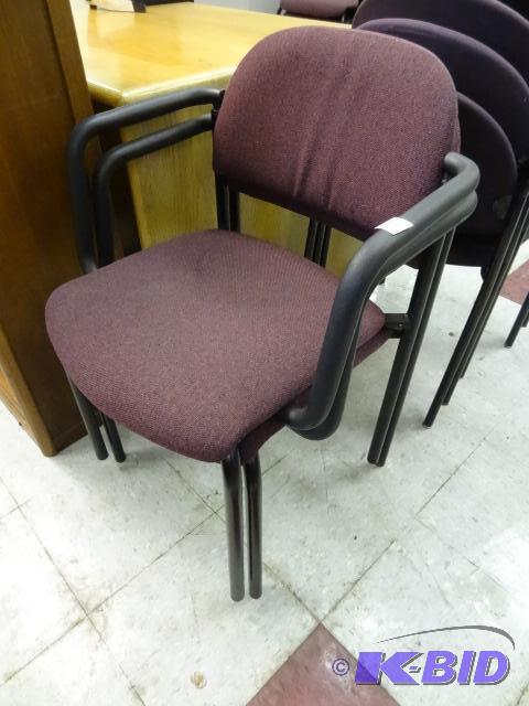 2 matching metal framed stack chairs...