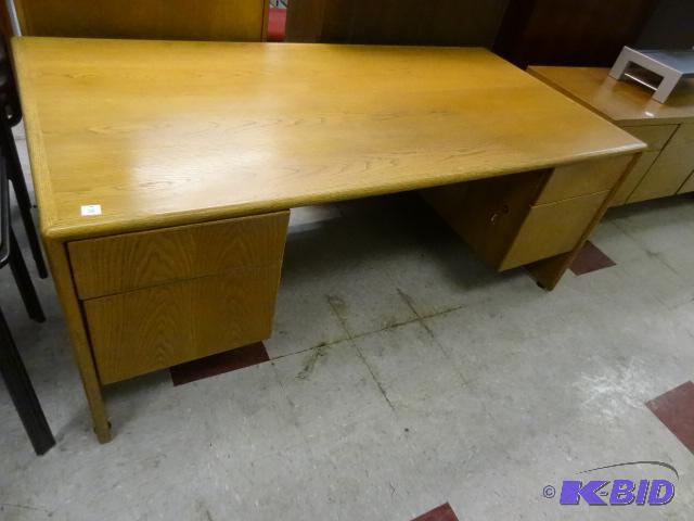 Wood office desk. 4 drawers. Has lock and key...