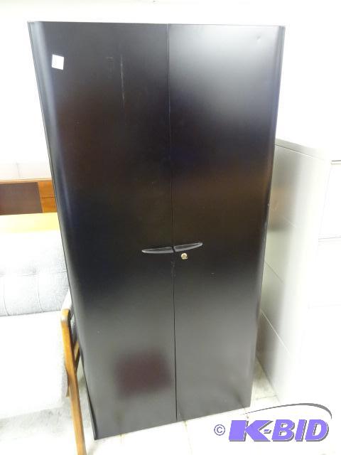 Metal 2 door with lock and key. 3 shelves. 30...