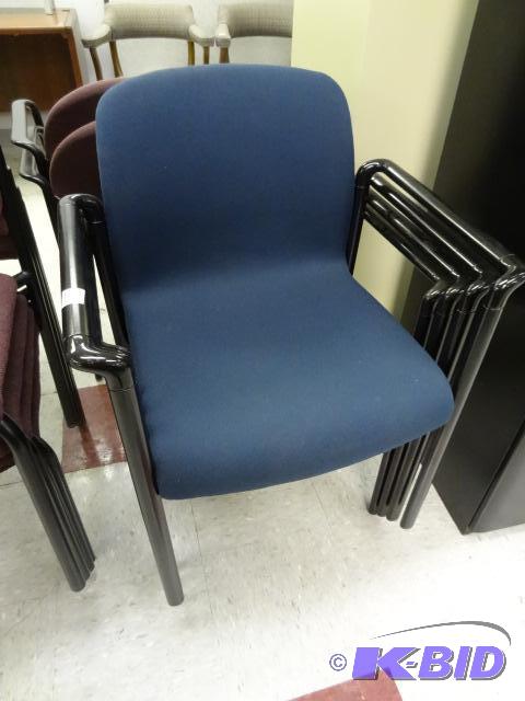 4 matching metal framed stack chairs...