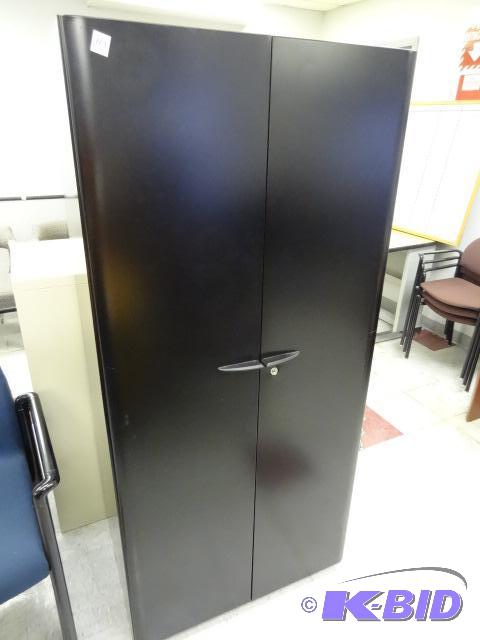 Metal 2 door cabinet. 3 shelves. 30 x 19 x 65...