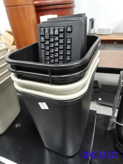 5 computer keyboards. 5 office garbage cans...