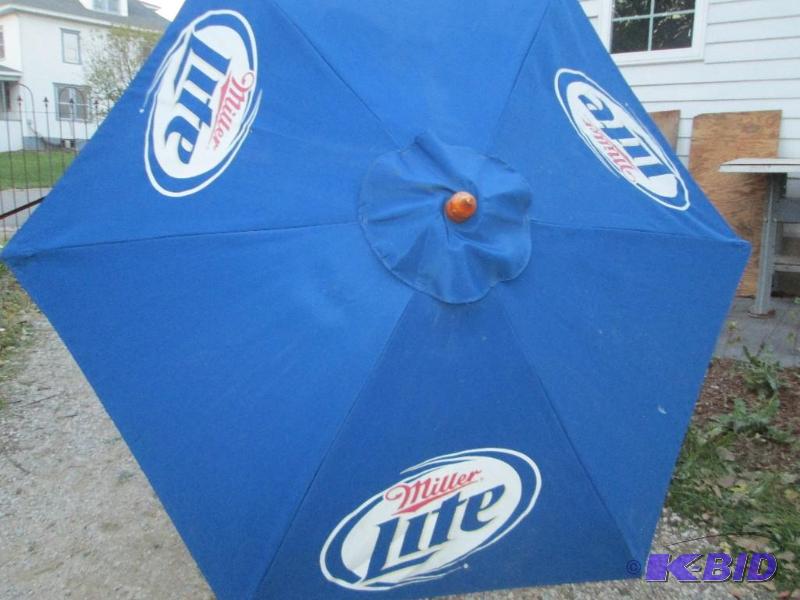 lot 132 image: Miller Lite patio table umbrella...