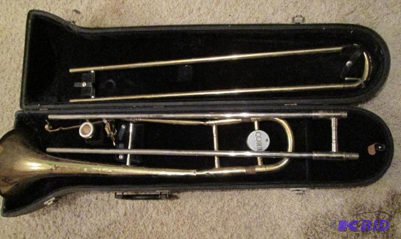lot 155 image: Trombone Conn Brand- needs cleaning...