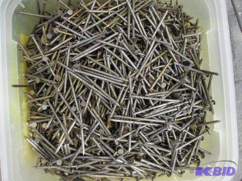 lot 21 image: Bucket of 2 12 inch nails...