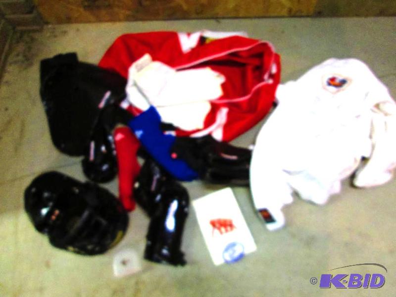 lot 416 image: Sport bag of assorted martial arts greaand pa...