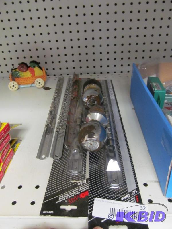 lot 32 image: socket organizers and tailer hitch balls