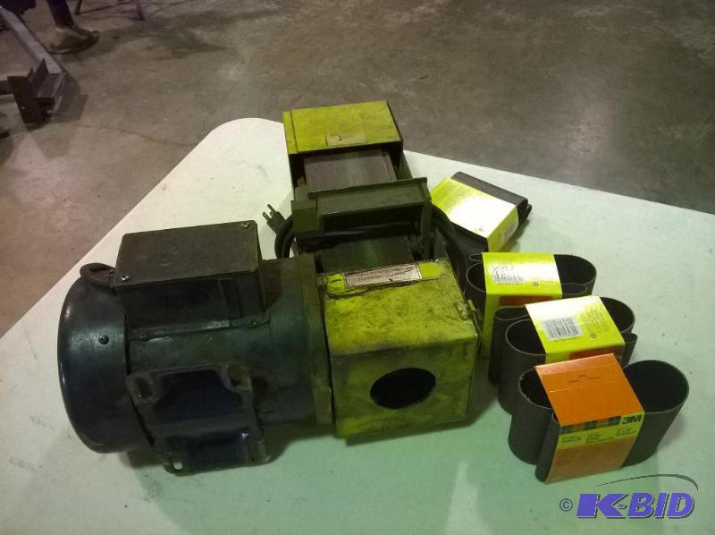 lot 23 image: 12hp Belt Sander with 4 New Belts