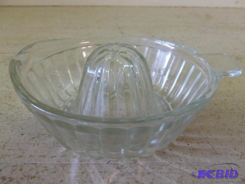 lot 25 image: Vintage glass juicer that measures 5 34"...