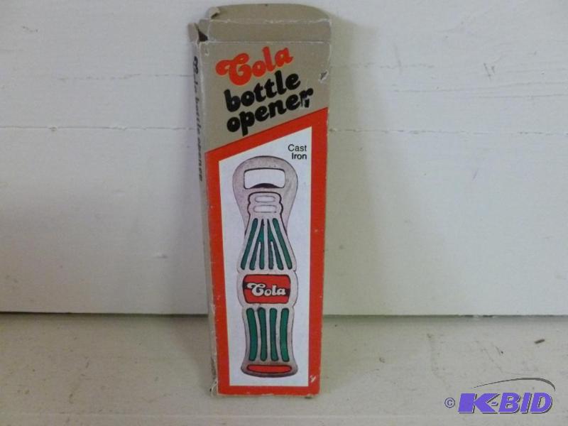 lot 91 image: Cast iron and stain glass cola bottle opener,...