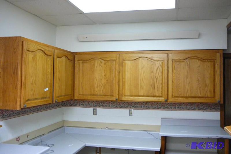 lot 203 image: Upper oak corner cabinets with shelves with a...