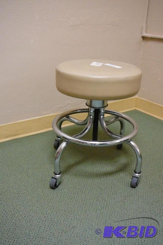 lot 258 image: Tan adjustable stool on casters ...