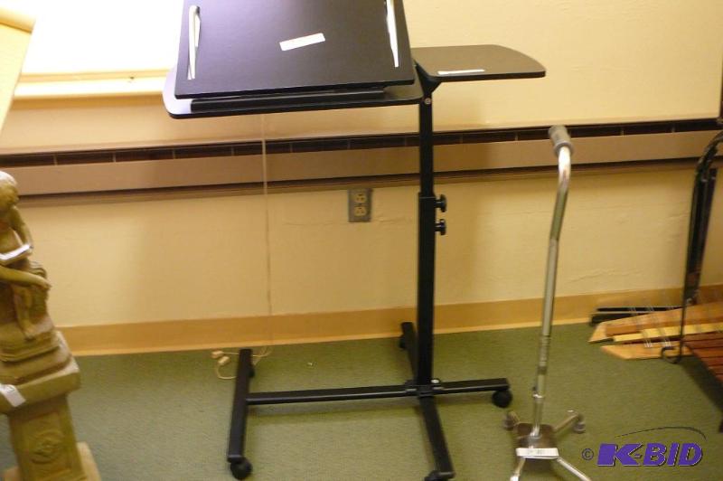 lot 270 image: Cane adjustable bed stand on casters  ...