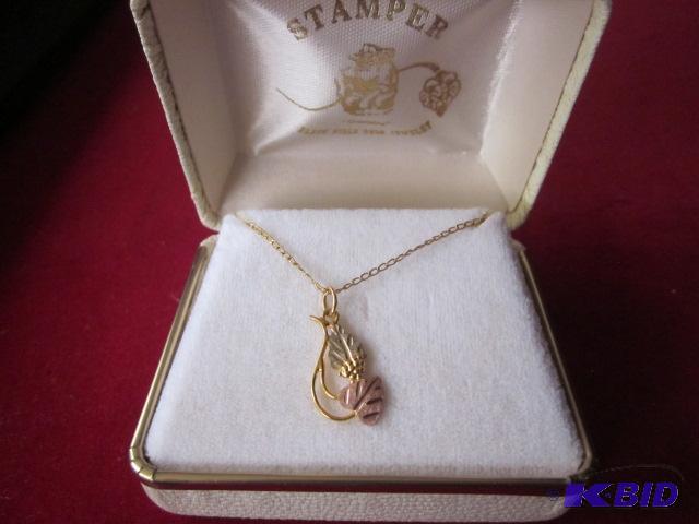 lot 1 image: 12 Karat Stamper 18 inch necklace with (2) to...