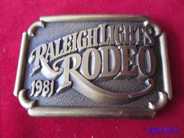 lot 20 image: 1981 Raleigh Lights Rodeo brass belt buckle....