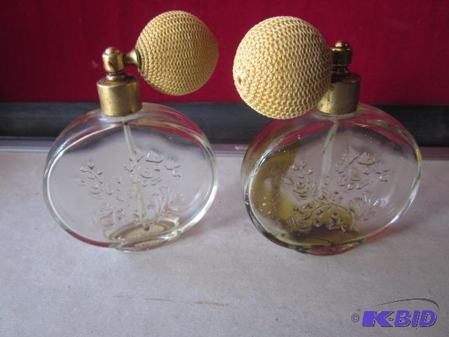 lot 33 image: Pair of glass with pump Avon perfume bottles....