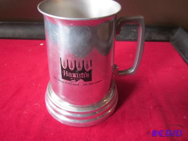lot 48 image: Metal with clear bottom Hamms Beer mug....