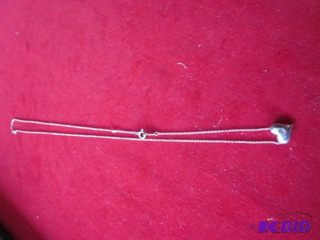 lot 6 image: Sterling Silver chain necklace with heart pen...