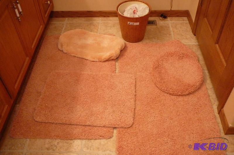 pink bathroom toilet cover and wicker basket&...