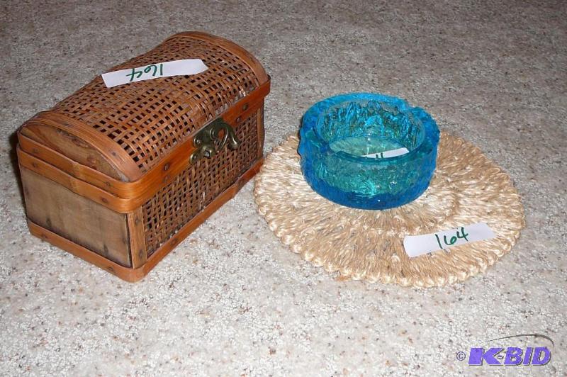 Decorative wooden chest and blue glass ash tr...