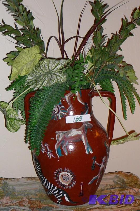 Large decorative vase with fake plant arrangm...