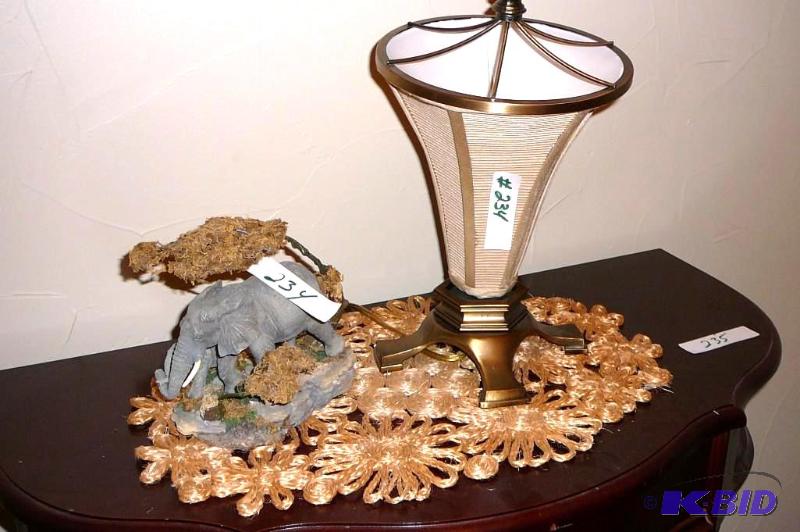 lot 234 image: Ceramic elephant statue and lamp with doily&n...
