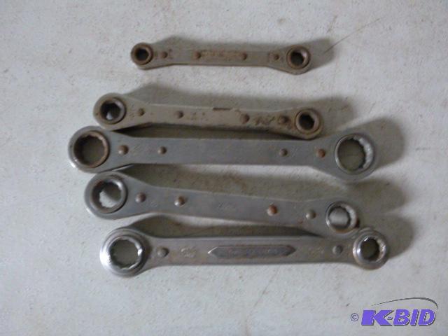 lot 143 image: Five Ratcheting Wrenches 2 metric and 3 SAE....
