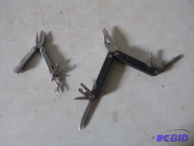 lot 166 image: Two Multi Tools Small one is missing one side...