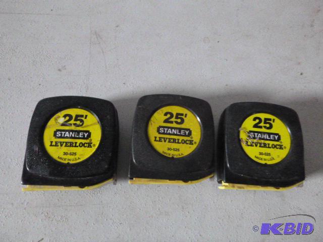 lot 38 image: Three 25 Stanley Leverlock Tape Measures...