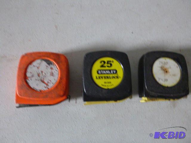 lot 40 image: Three 25 Tape Measures...
