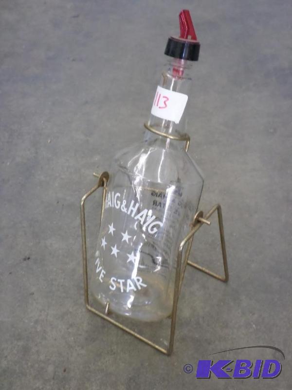 lot 113 image: Haig & Haig Glass Bottle With Stand...