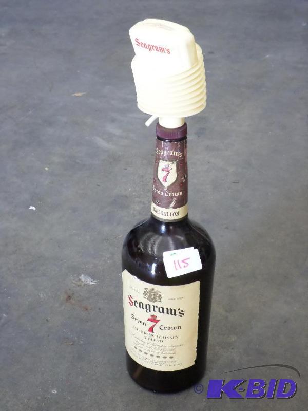 lot 115 image: Seagrams 1-Gallon Glass Bottle With Dispenser...