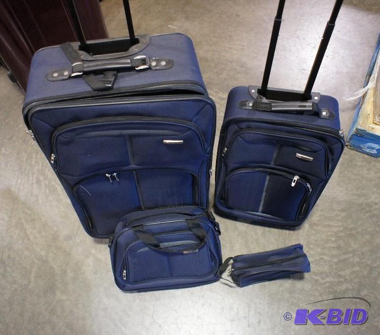 lot 11 image: Tag 4 pc luggage set. Blue in color. Dimensio...