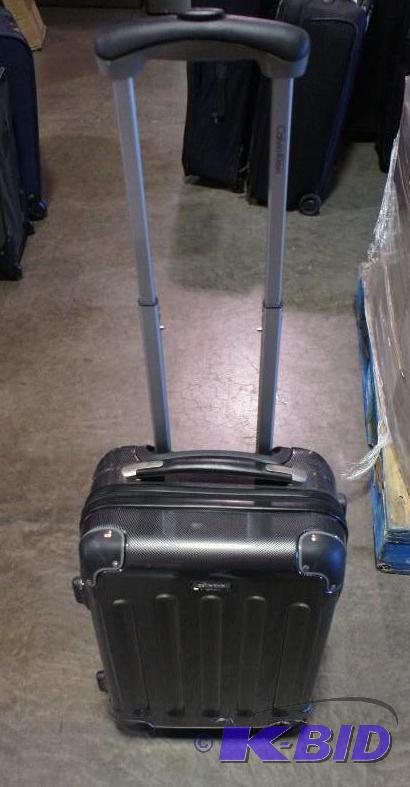 lot 19 image: New Calvin Klein 360 spinner luggage bag. Gr...
