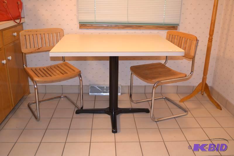 lot 134 image: Kitchen table and 2 chairs 40x35"...