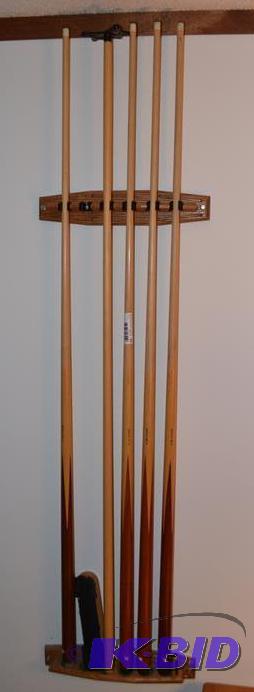 lot 87 image: Five pool cue sticks, bracket and brush...