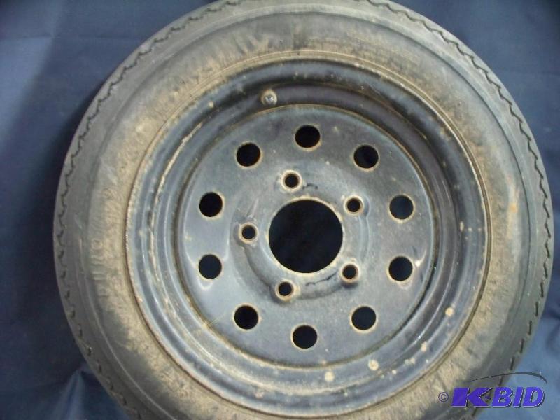 lot 61 image: Trailer tire 4.80x12 5 hole rim...